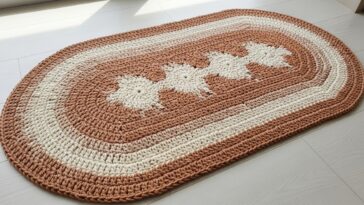 Tapete oval em crochê com ponto estrela para aconchegar sua sala de estar com carinho